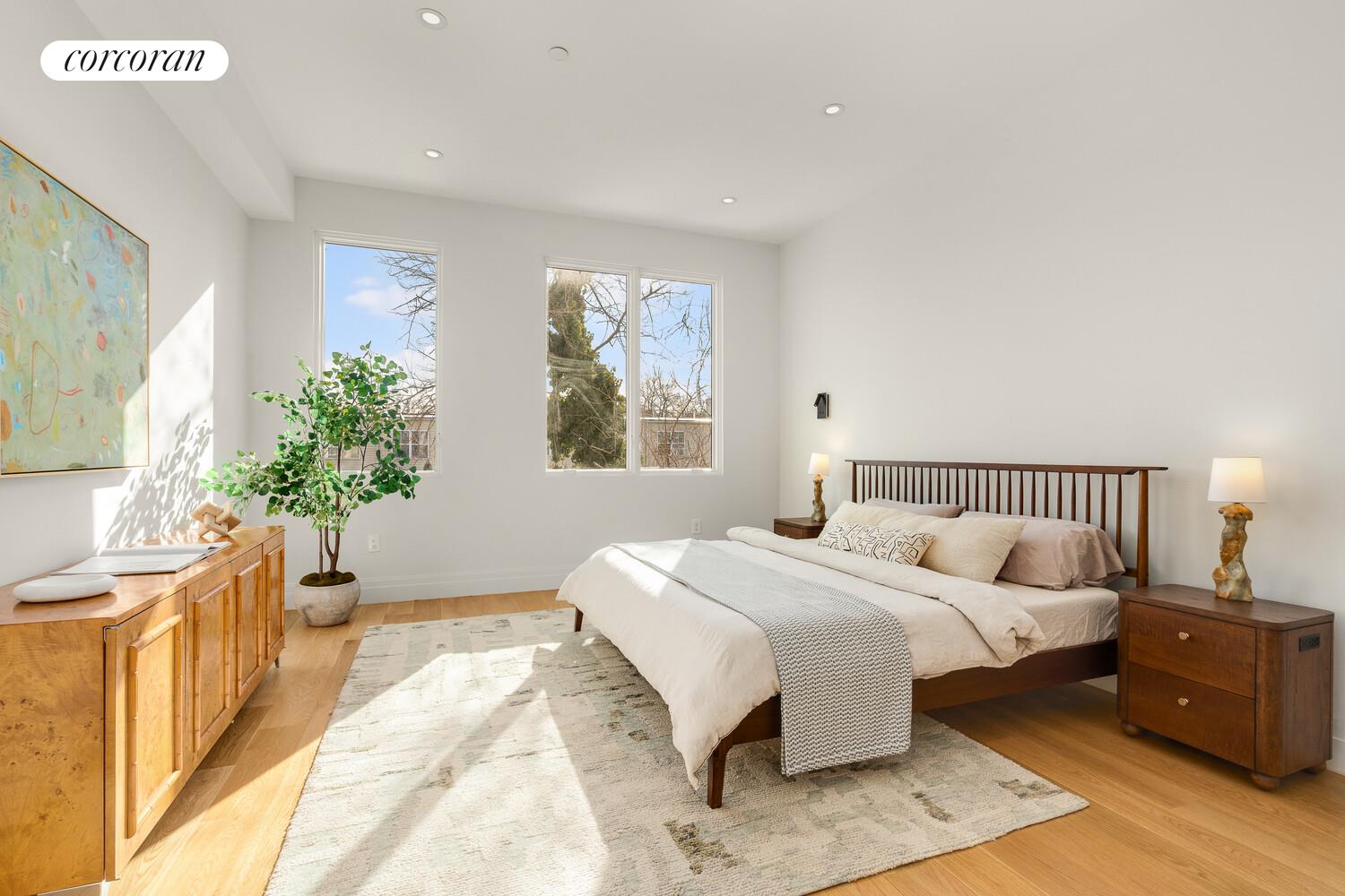 1148 Decatur Street Brooklyn, NY 11207 - Photo 8 of 14 a bedroom with a large bed and a window