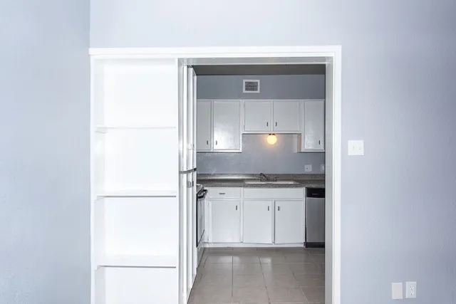 a view of swimming pool with palm trees