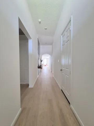 a view of hallway with livingroom