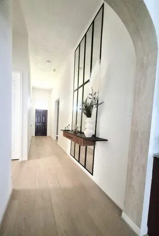 a view of an entryway with wooden floor