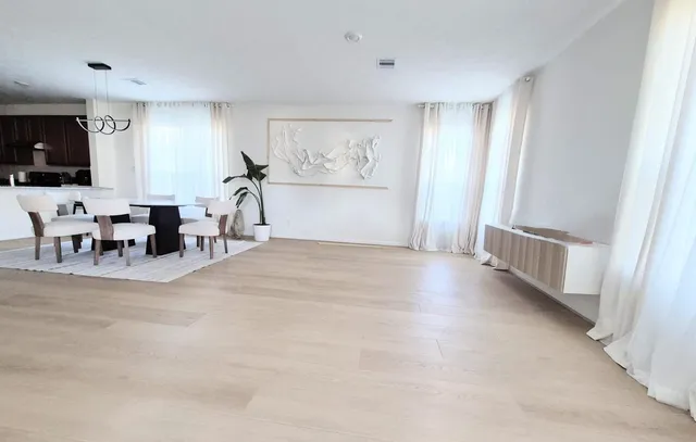 a view of a livingroom with furniture and windows