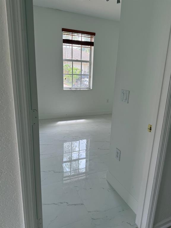 1720 Northwest 78th Way, Unit 1720 Pembroke Pines, FL 33024 - Photo 9 of 9 a view of an empty room with a window