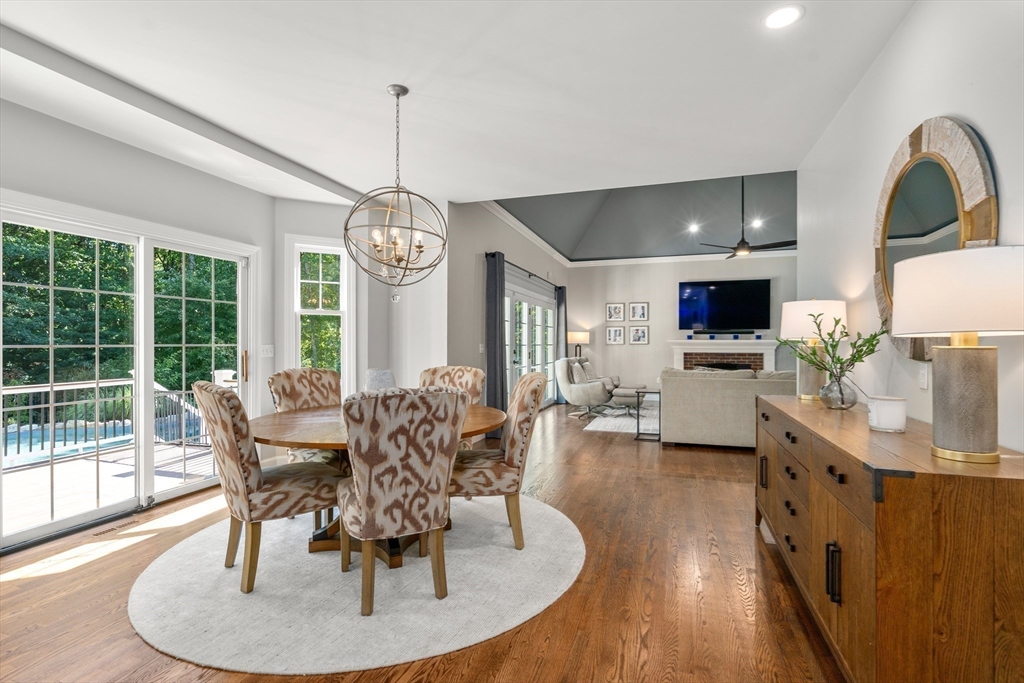 9 MacIntyre Drive North Reading, MA 01864 - Photo 11 of 41 a dining room with furniture garden view and a chandelier