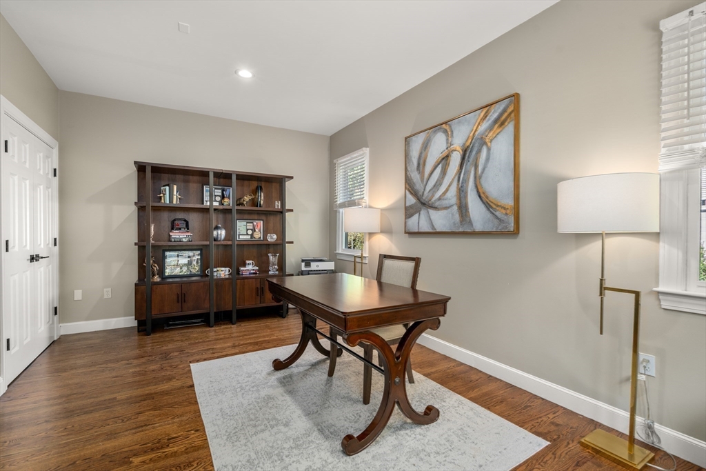9 MacIntyre Drive North Reading, MA 01864 - Photo 15 of 41 a living room with furniture a desk and chair with wooden floor