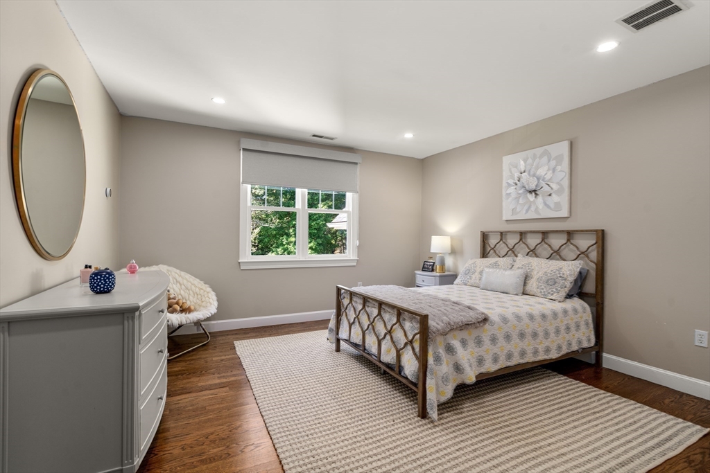9 MacIntyre Drive North Reading, MA 01864 - Photo 22 of 41 a living room with a bed furniture and a window