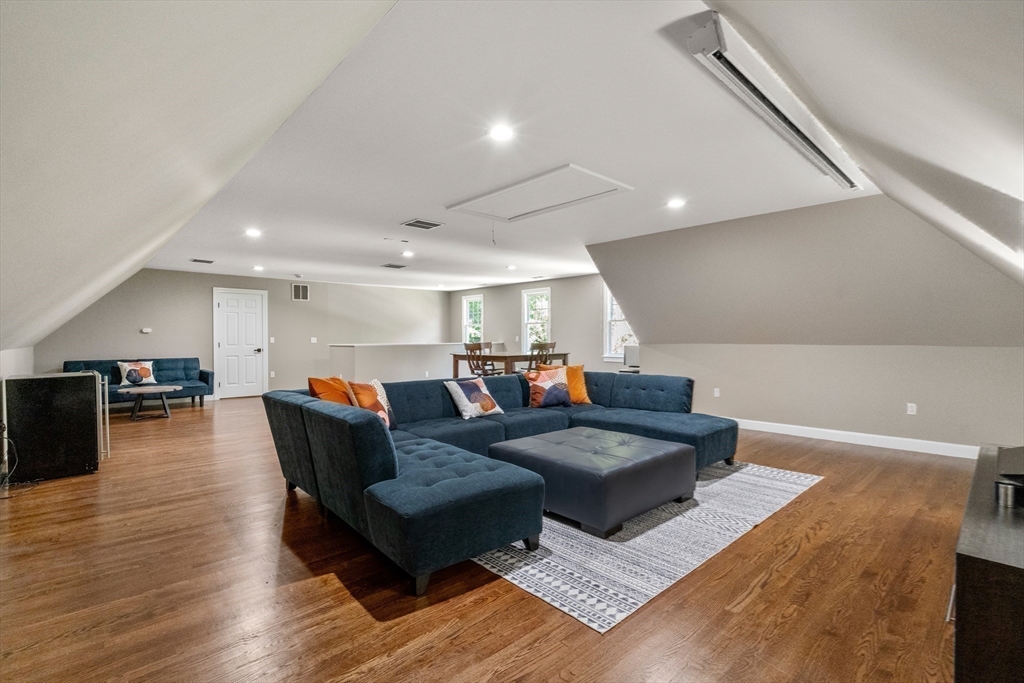 9 MacIntyre Drive North Reading, MA 01864 - Photo 26 of 41 a living room with furniture and a wooden floor