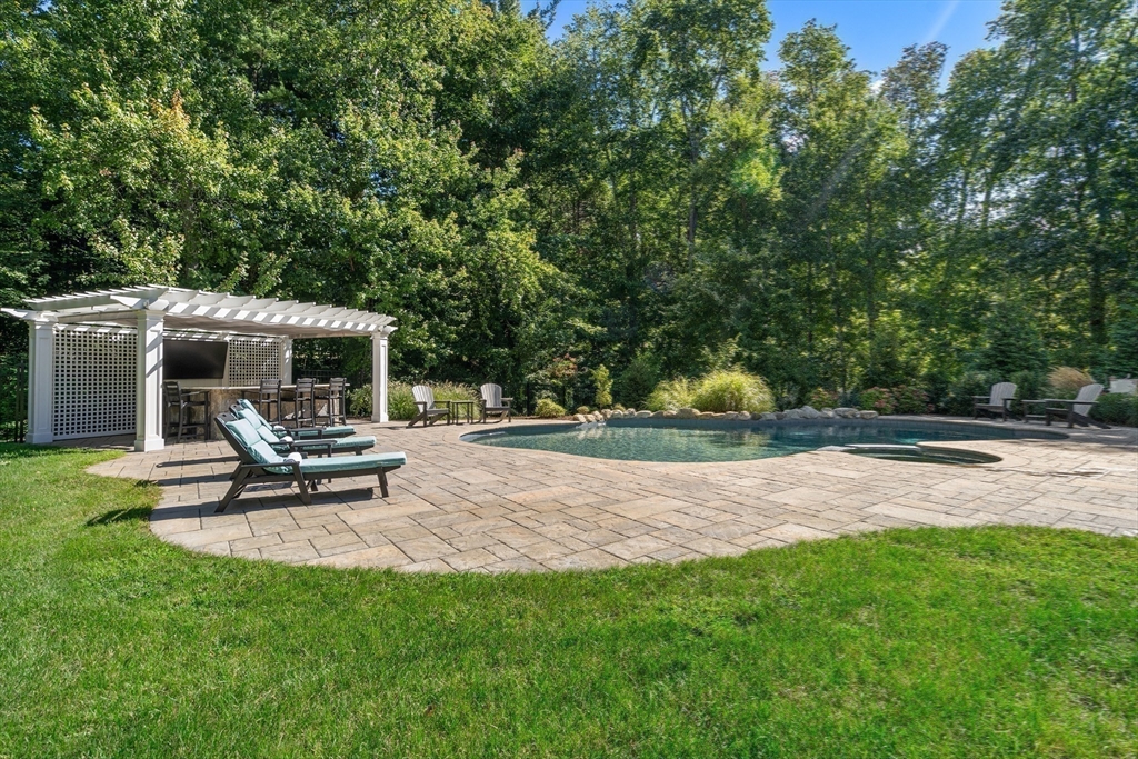9 MacIntyre Drive North Reading, MA 01864 - Photo 29 of 41 a view of a patio with a table and chairs