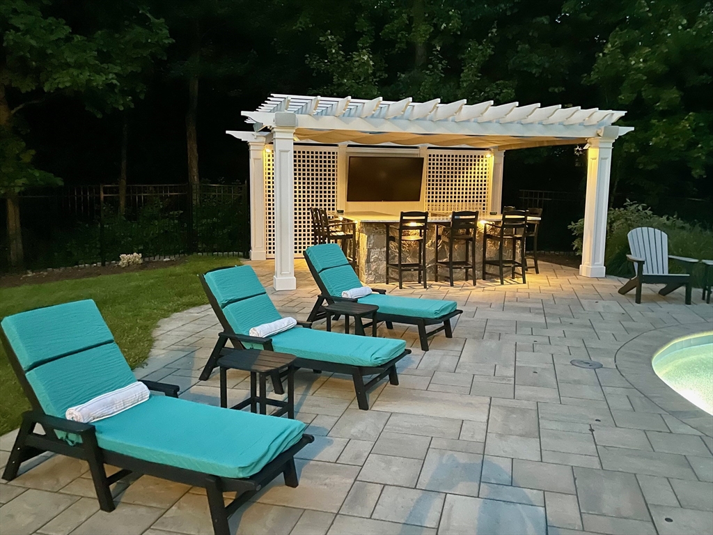 9 MacIntyre Drive North Reading, MA 01864 - Photo 40 of 41 a view of a chairs and table in backyard of the house