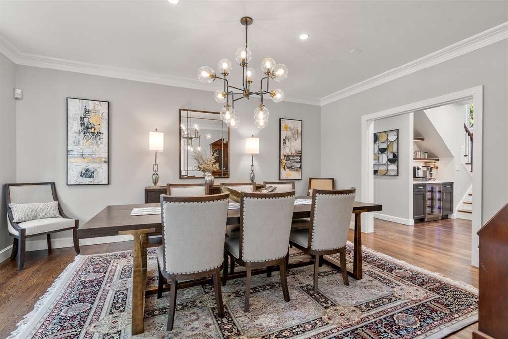 9 MacIntyre Drive North Reading, MA 01864 - Photo 7 of 41 a view of a dining room with furniture and wooden floor