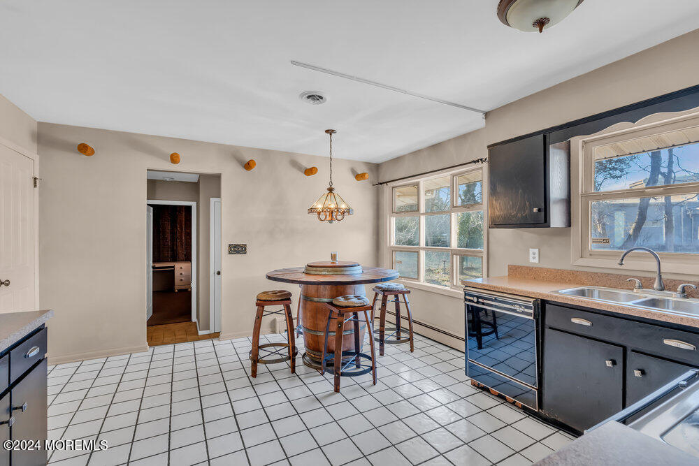 1400 Lanes Mill Road Lakewood, NJ 08701 - Photo 20 of 40 a room with stainless steel appliances kitchen island granite countertop a sink and cabinets