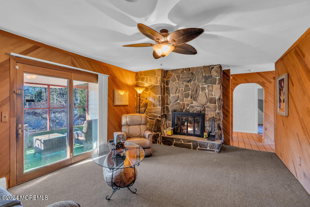 1400 Lanes Mill Road Lakewood, NJ 08701 - Photo 24 of 40 a living room with furniture a ceiling fan and a large window