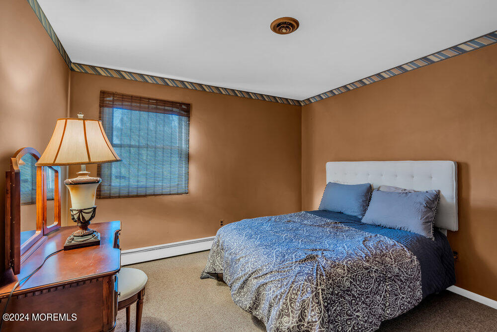 1400 Lanes Mill Road Lakewood, NJ 08701 - Photo 26 of 40 a bedroom with a bed and a dresser