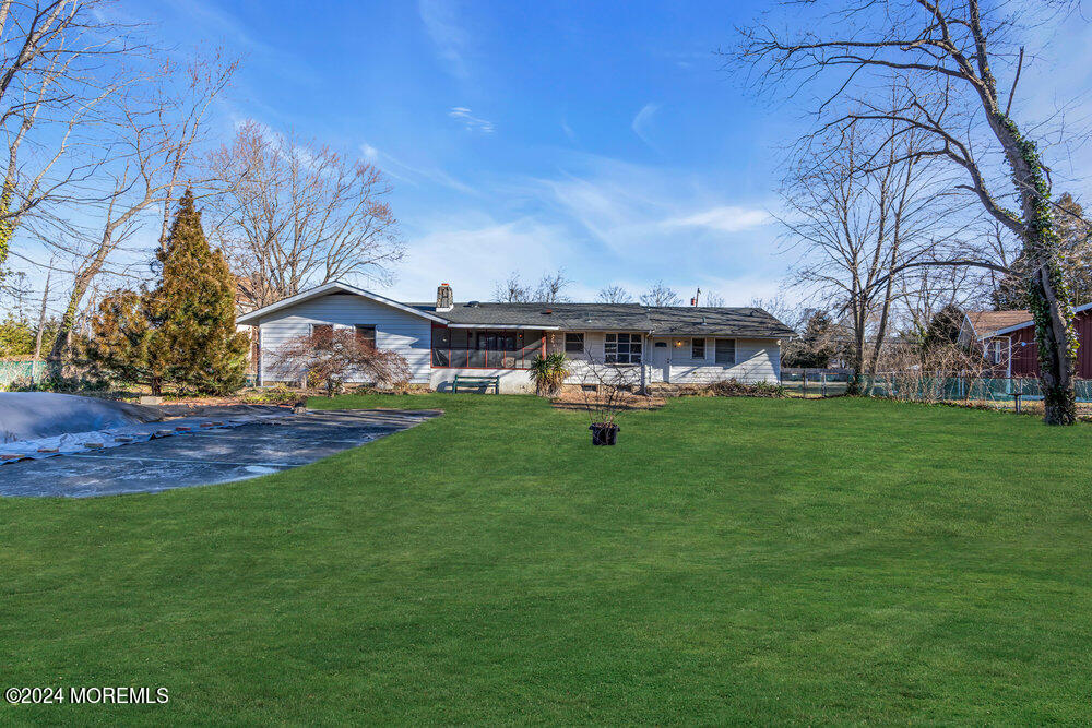 1400 Lanes Mill Road Lakewood, NJ 08701 - Photo 29 of 40 a view of a house with a big yard