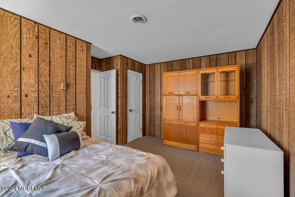 1400 Lanes Mill Road Lakewood, NJ 08701 - Photo 30 of 40 a bedroom with furniture and a window