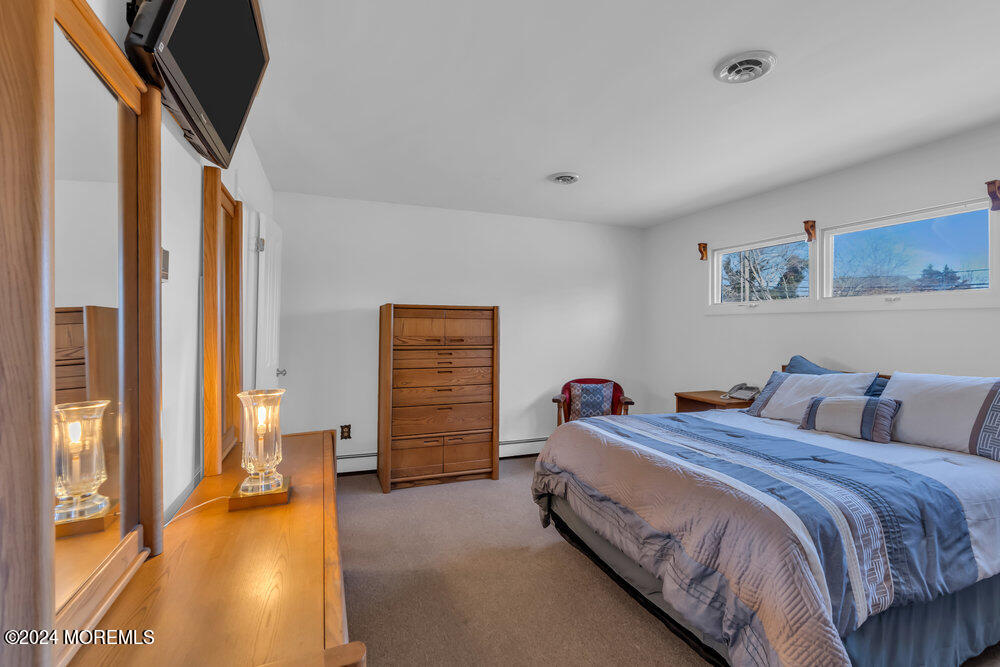 1400 Lanes Mill Road Lakewood, NJ 08701 - Photo 31 of 40 a bedroom with bed and a large window