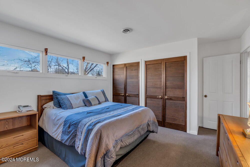 1400 Lanes Mill Road Lakewood, NJ 08701 - Photo 32 of 40 a bedroom with a bed and a dresser