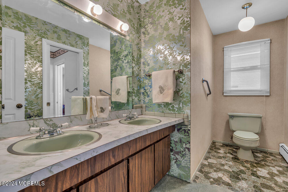 1400 Lanes Mill Road Lakewood, NJ 08701 - Photo 37 of 40 a bathroom with a double vanity sink and a mirror