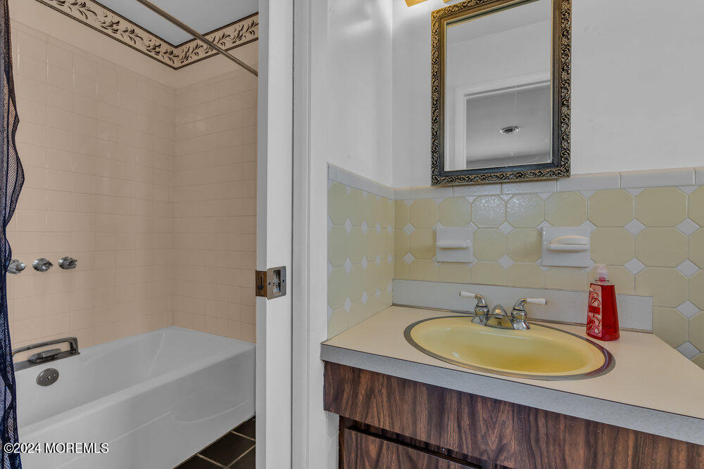 1400 Lanes Mill Road Lakewood, NJ 08701 - Photo 38 of 40 a bathroom with a sink and a mirror