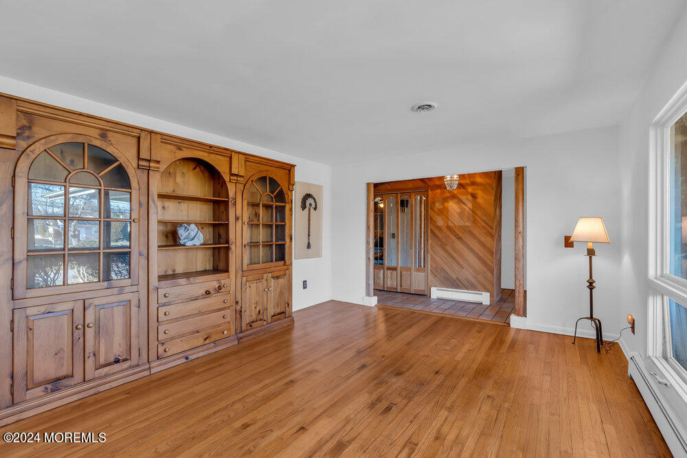 1400 Lanes Mill Road Lakewood, NJ 08701 - Photo 4 of 40 wooden floor in an empty room with a window
