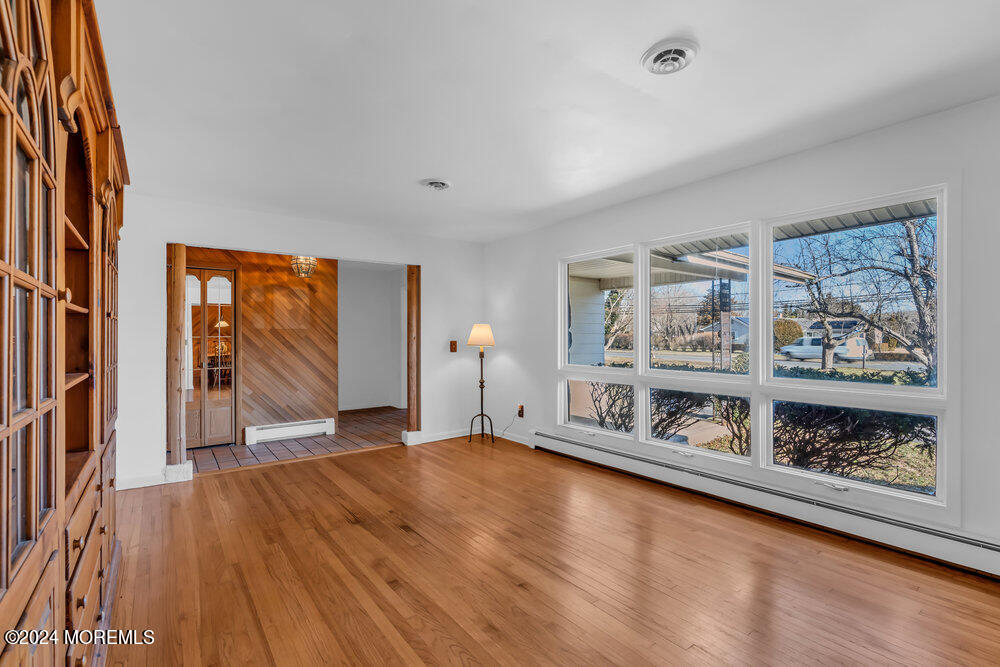 1400 Lanes Mill Road Lakewood, NJ 08701 - Photo 5 of 40 wooden floor in an empty room with a window