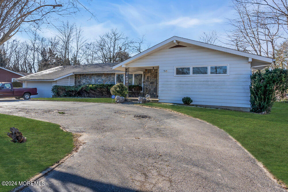 1400 Lanes Mill Road Lakewood, NJ 08701 - Photo 8 of 40 a front view of a house with a yard