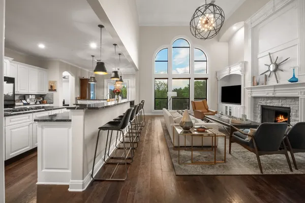 a large kitchen with a table and chairs in it