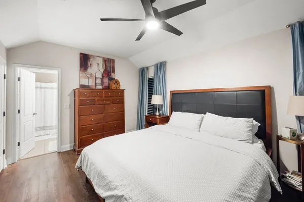 a bedroom with a bed and a dresser