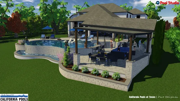 a view of a house with backyard fountain and sitting area