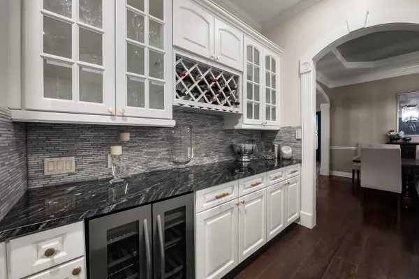 a kitchen with stainless steel appliances granite countertop a sink and cabinets