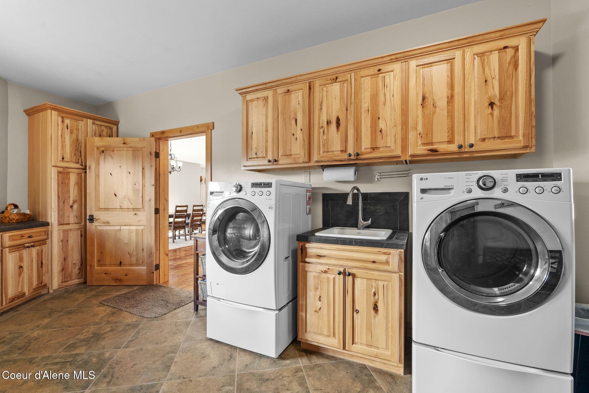 422 Lightning Peak Road Sandpoint, ID 83864 - Photo 34 of 92 Laundry room sink