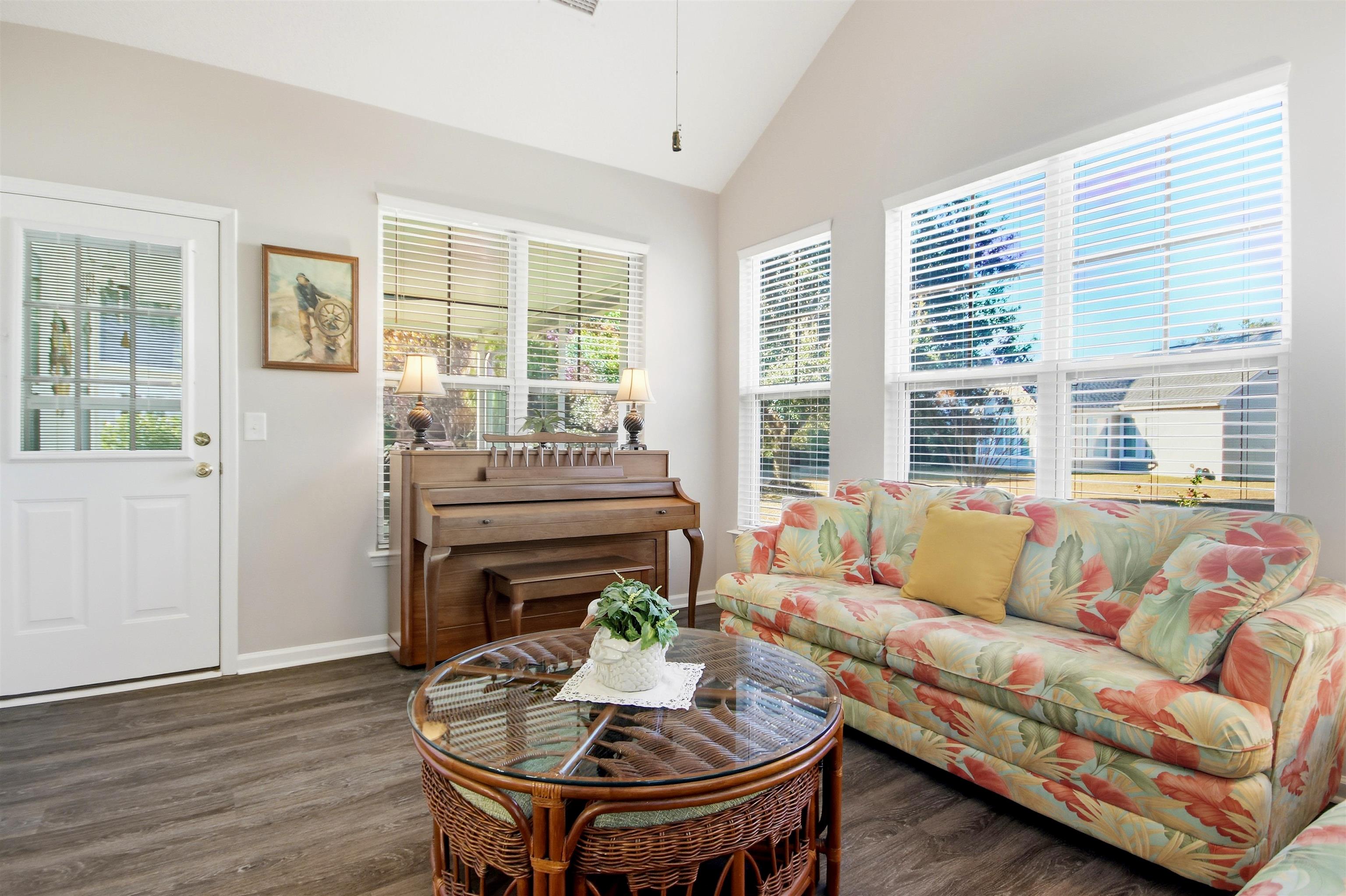 4 Guillemont Court Murrells Inlet, SC 29576 - Photo 15 of 40 Living room with lofted ceiling and dark wood-type flooring