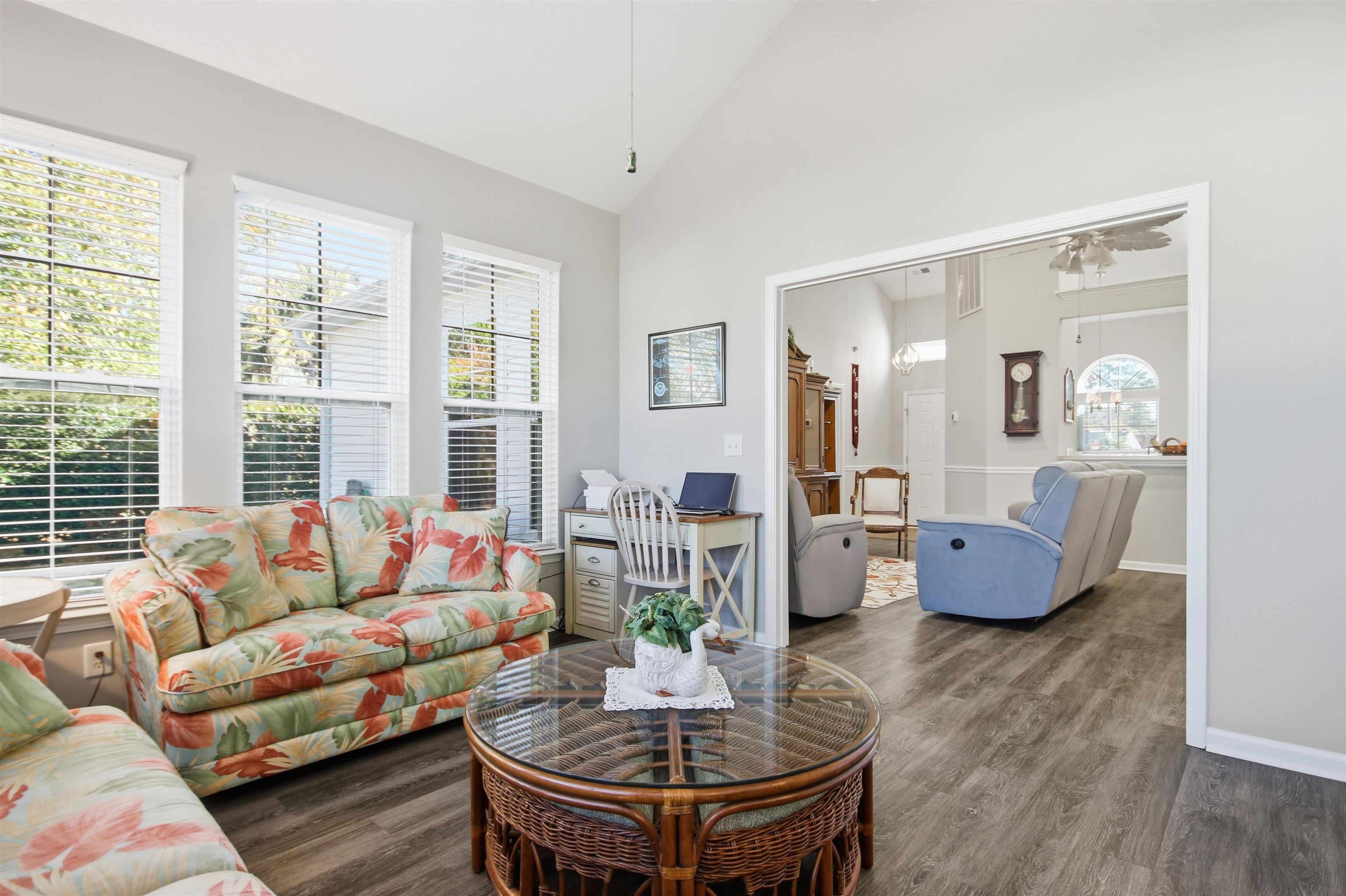 4 Guillemont Court Murrells Inlet, SC 29576 - Photo 17 of 40 Living area featuring high vaulted ceiling, healthy amount of natural light, dark wood finished floors, and a ceiling fan