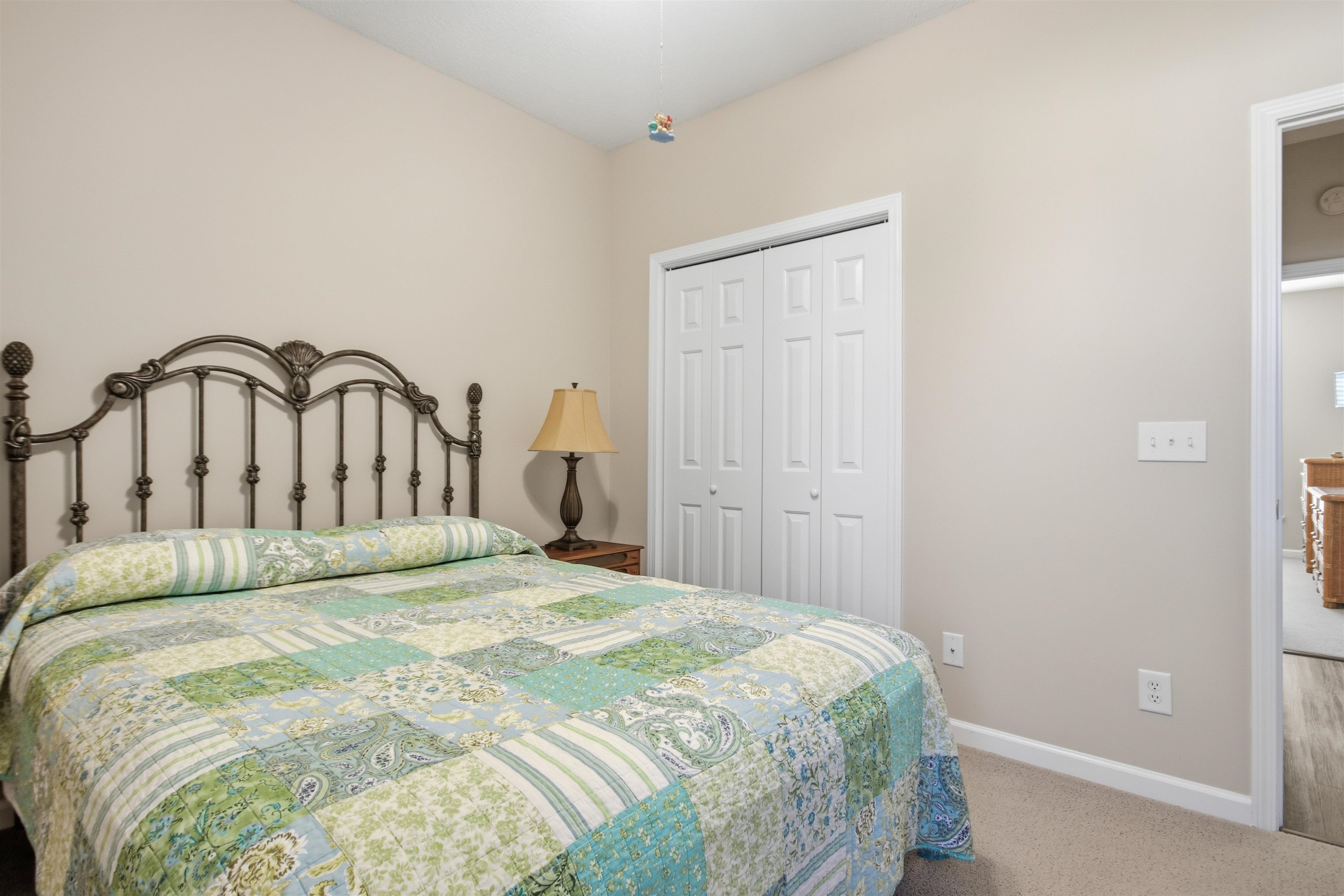 4 Guillemont Court Murrells Inlet, SC 29576 - Photo 22 of 40 Carpeted bedroom with baseboards and a closet