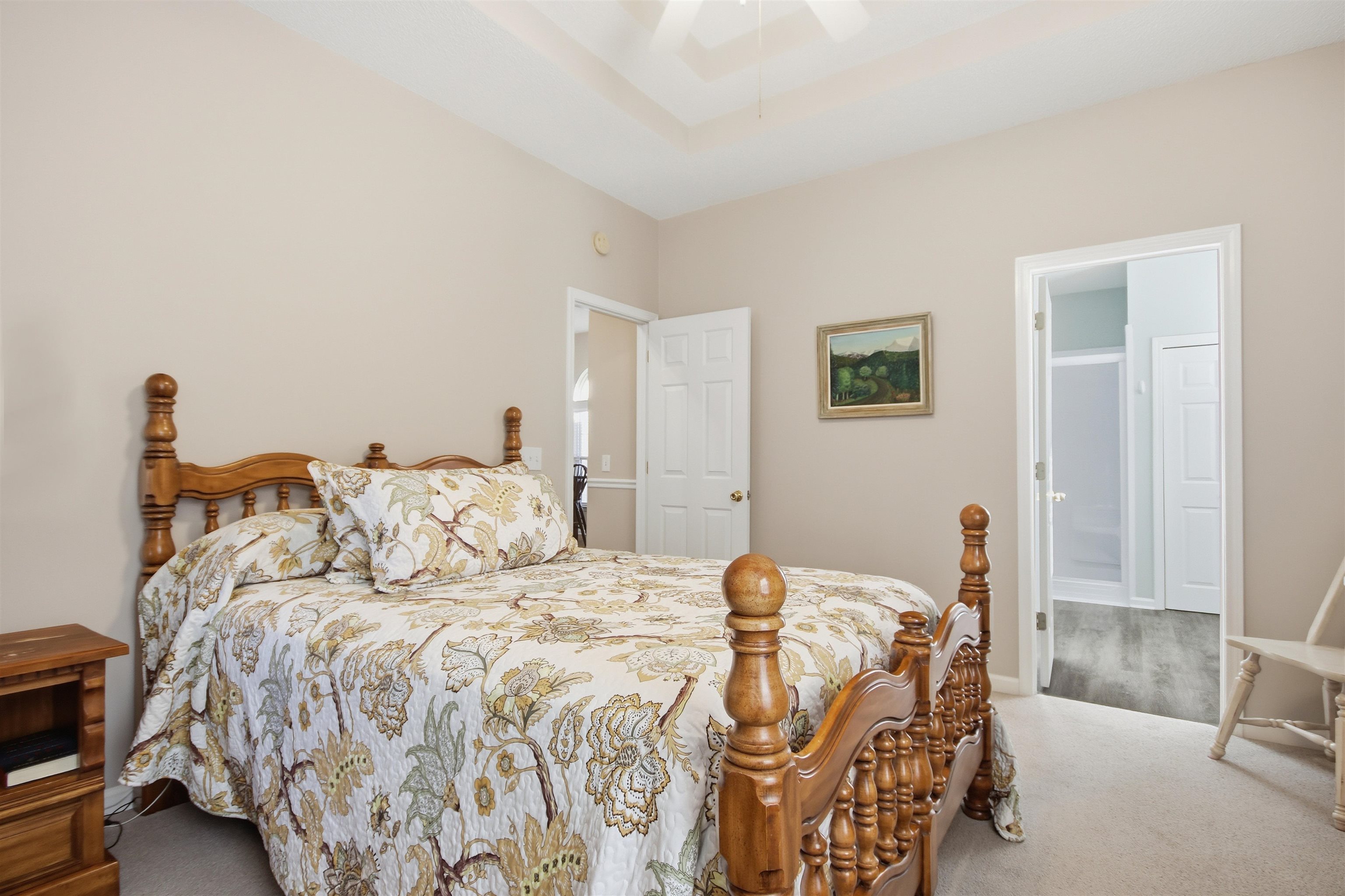4 Guillemont Court Murrells Inlet, SC 29576 - Photo 24 of 40 Carpeted bedroom featuring a raised ceiling, a ceiling fan, and ensuite bath