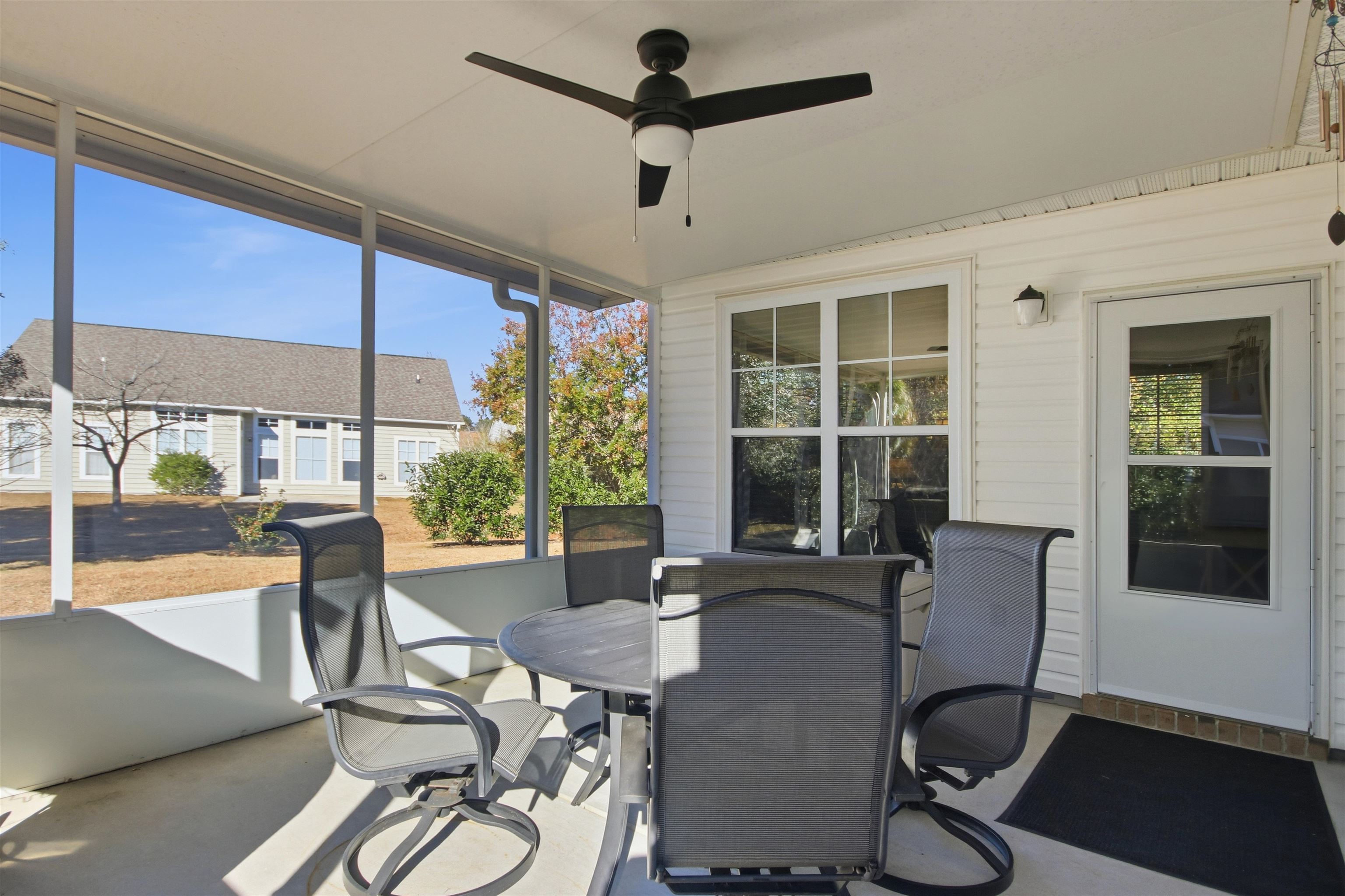 4 Guillemont Court Murrells Inlet, SC 29576 - Photo 28 of 40 Sunroom / solarium featuring outdoor dining area, healthy amount of natural light, and a ceiling fan