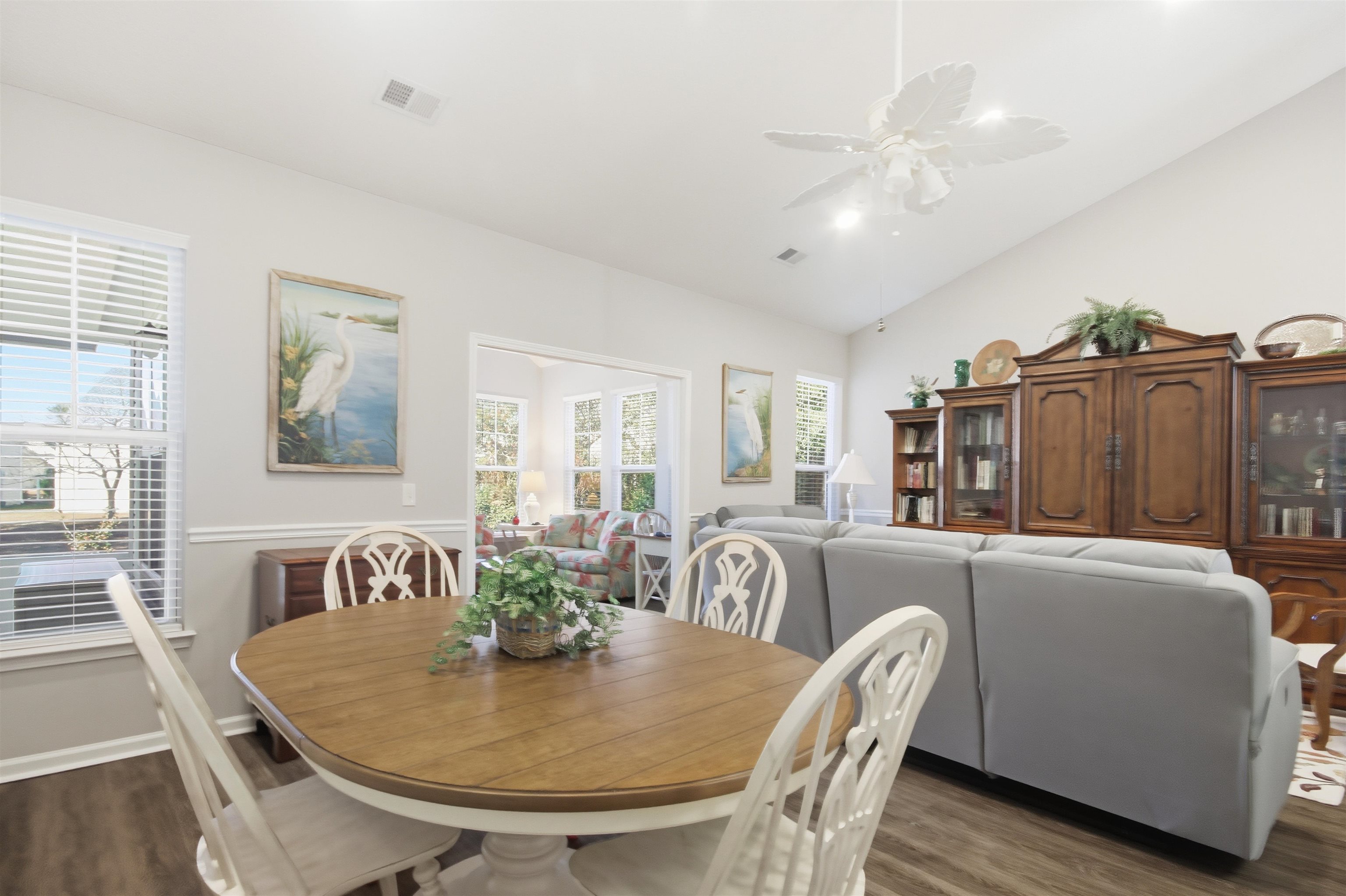 4 Guillemont Court Murrells Inlet, SC 29576 - Photo 9 of 40 Dining space with wood finished floors, lofted ceiling, and ceiling fan