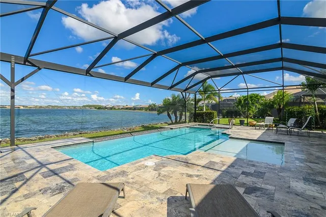 a view of swimming pool with a patio