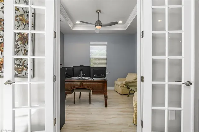 a workspace with wooden floor and a window