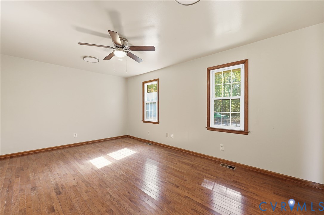 2521 Fort Lee Road Petersburg, VA 23805 - Photo 16 of 27 a view of empty room with wooden floor and fan