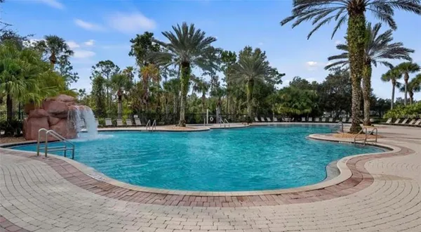 a view of a swimming pool with a sitting space