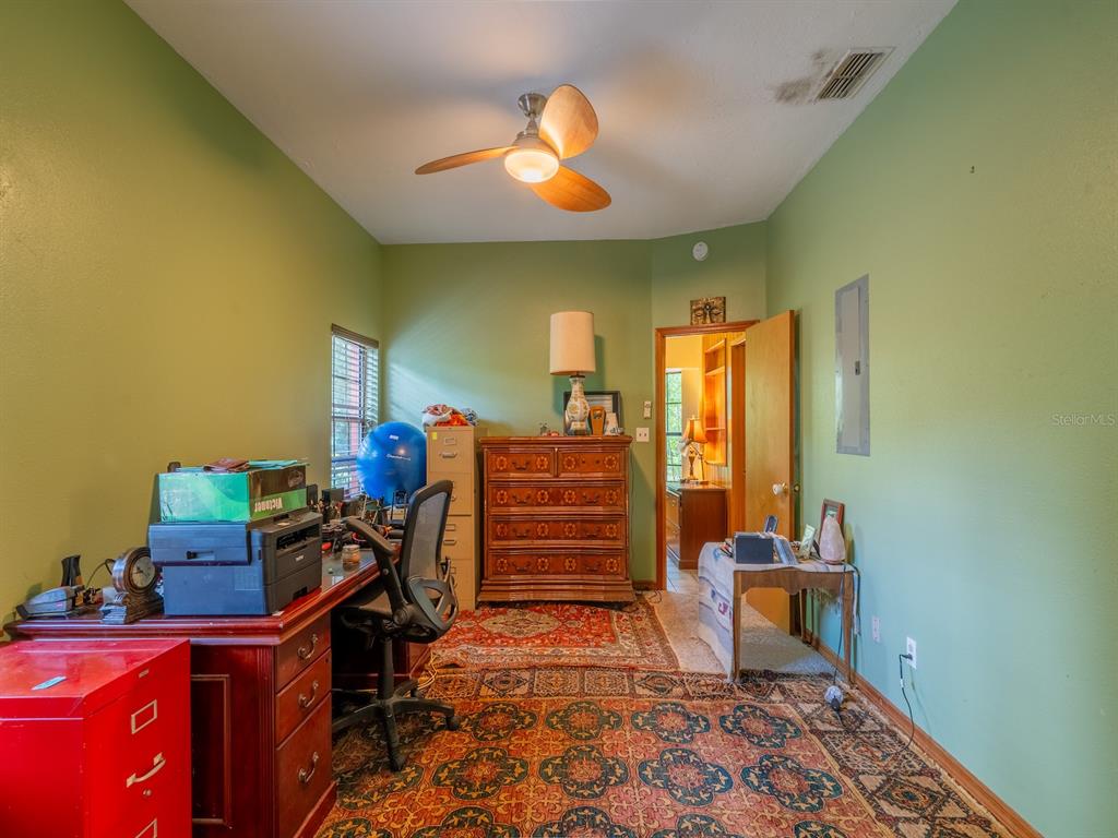23610 Northeast 154th Place Road Fort McCoy, FL 32134 - Photo 20 of 44 a room with furniture and musical instruments