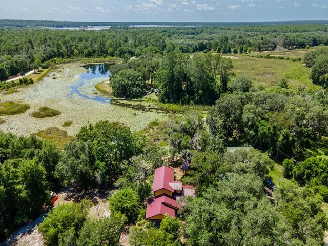 a view of a lake with a yard