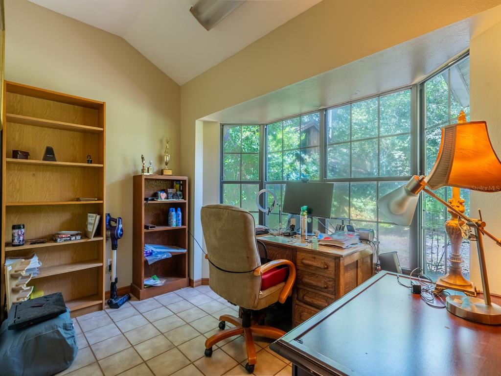 23610 Northeast 154th Place Road Fort McCoy, FL 32134 - Photo 21 of 44 a room with furniture and a window