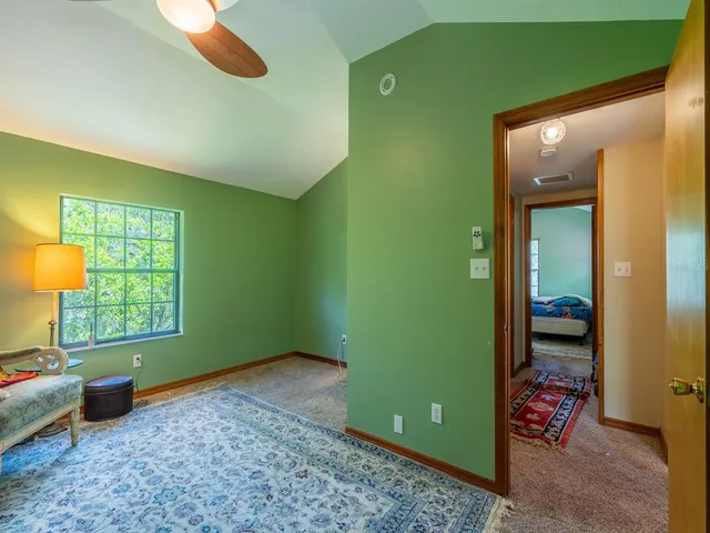 a bedroom with two beds and a window