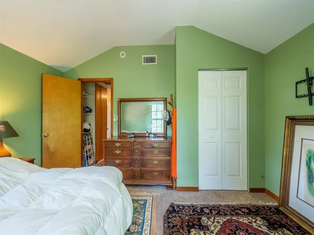 a room with a dresser and a window