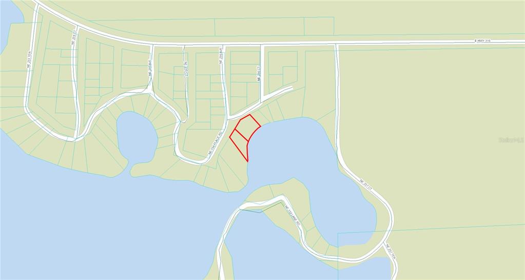 23610 Northeast 154th Place Road Fort McCoy, FL 32134 - Photo 42 of 44 a bathroom with a sink and a mirror