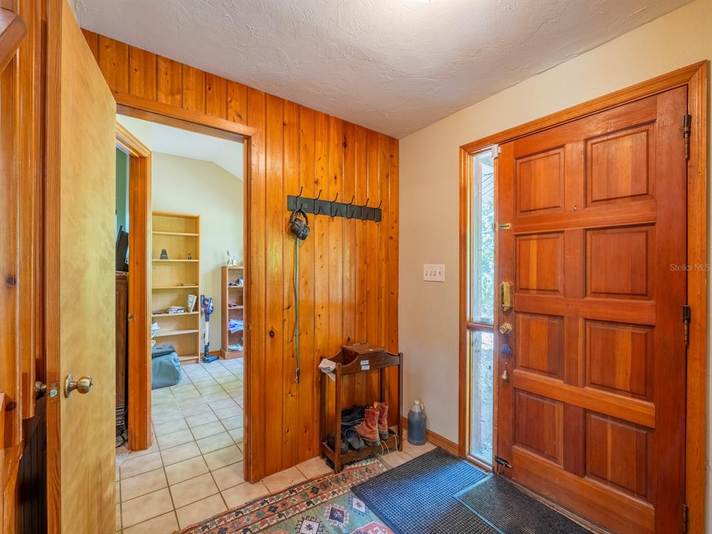 23610 Northeast 154th Place Road Fort McCoy, FL 32134 - Photo 8 of 44 wooden floor and windows in a room