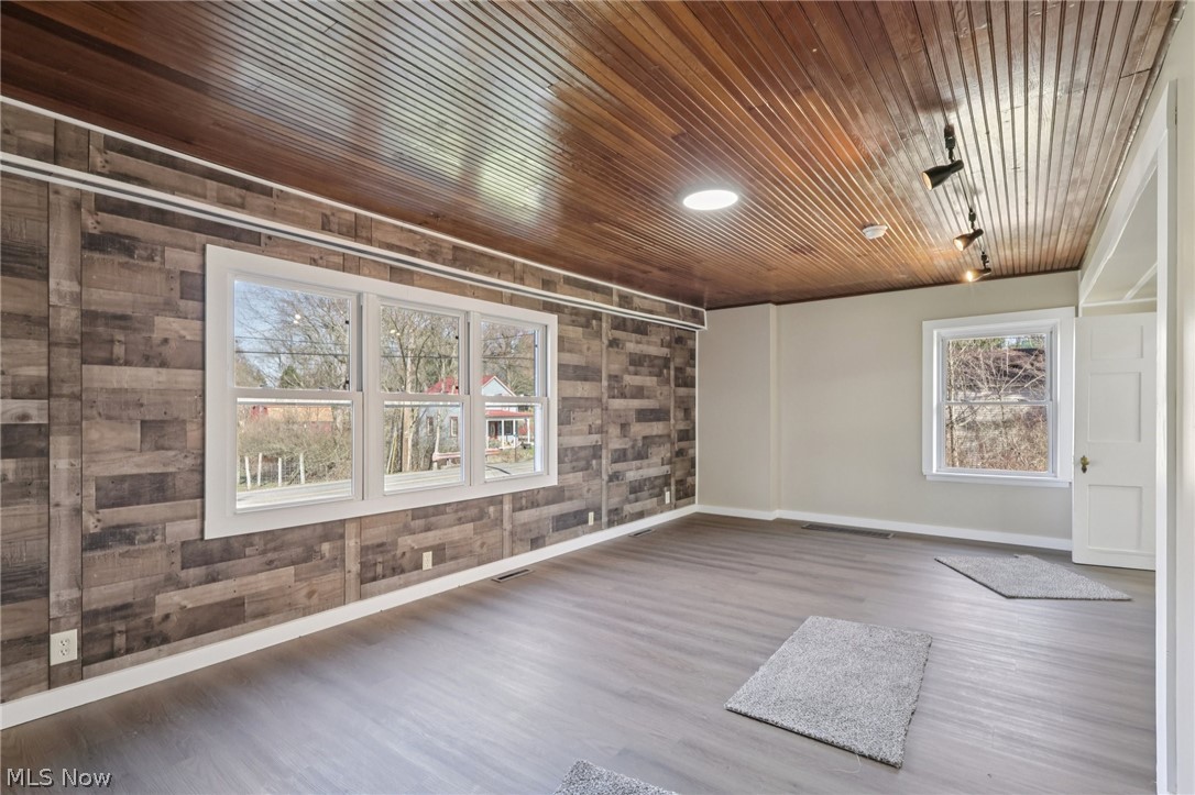 4200 Hattrick Road Rootstown, OH 44272 - Photo 4 of 42 Spare room with wood finished floors and baseboards
