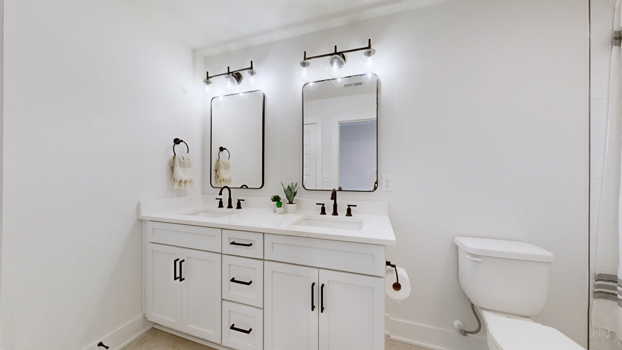 1805 Golf Club Road Old Hickory, TN 37138 - Photo 18 of 26 a bathroom with a toilet a sink and mirror