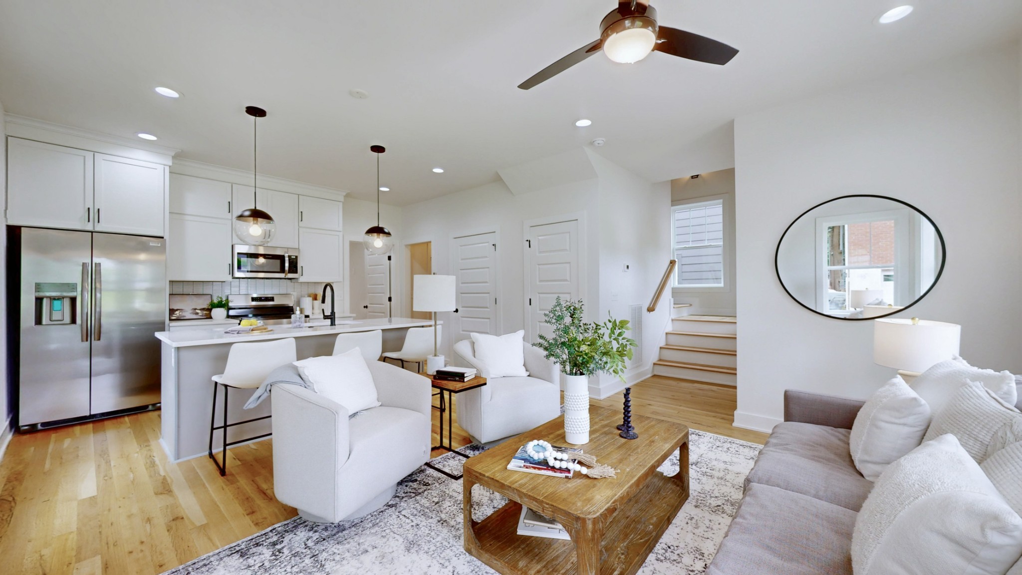 1805 Golf Club Road Old Hickory, TN 37138 - Photo 2 of 26 a living room with furniture a rug kitchen view and a chandelier